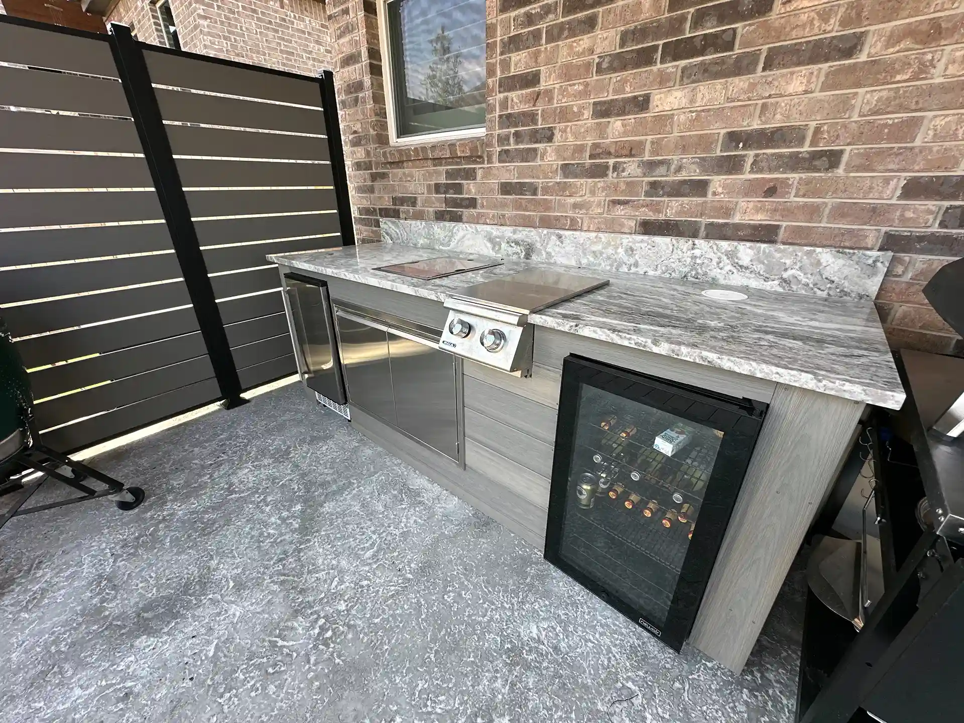 Light gray stained concrete with a smooth finish and subtle textured pattern. 