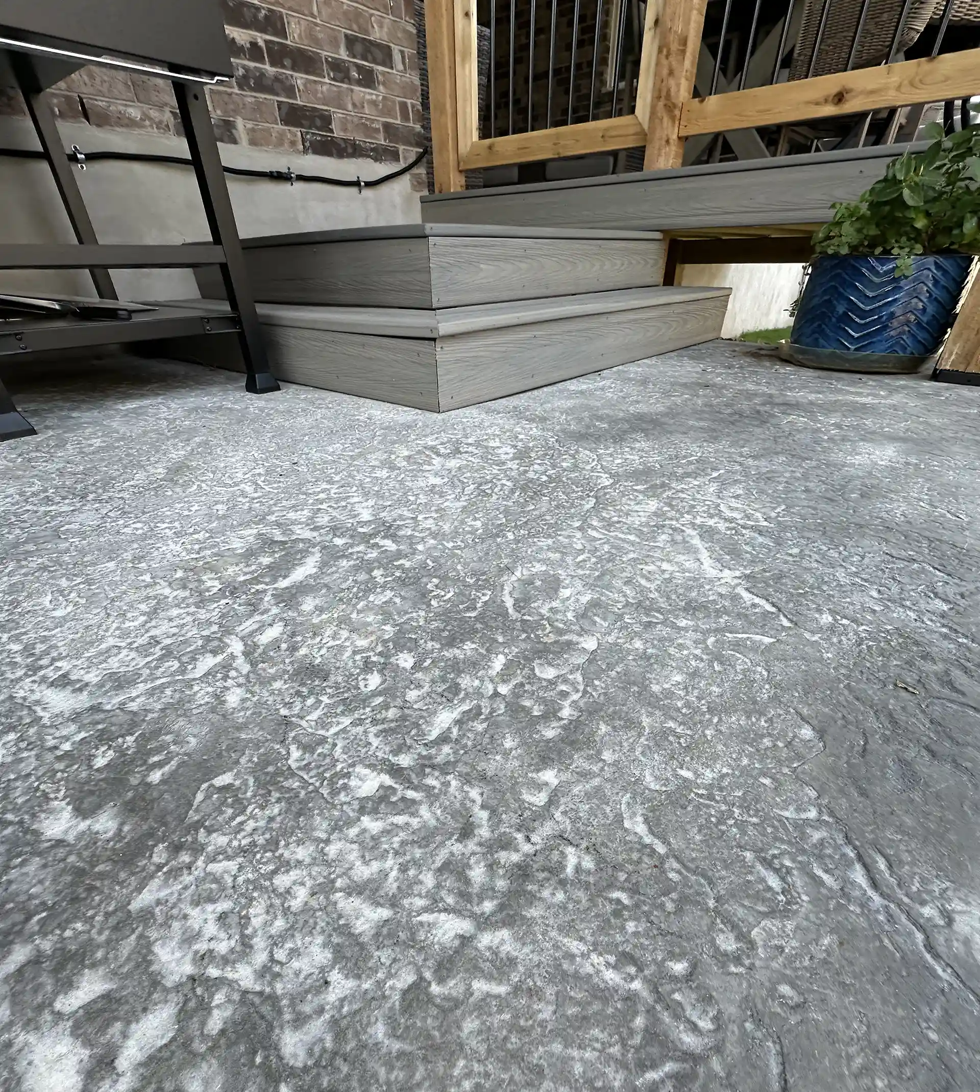 Gray concrete surface with subtle veining and a polished finish 