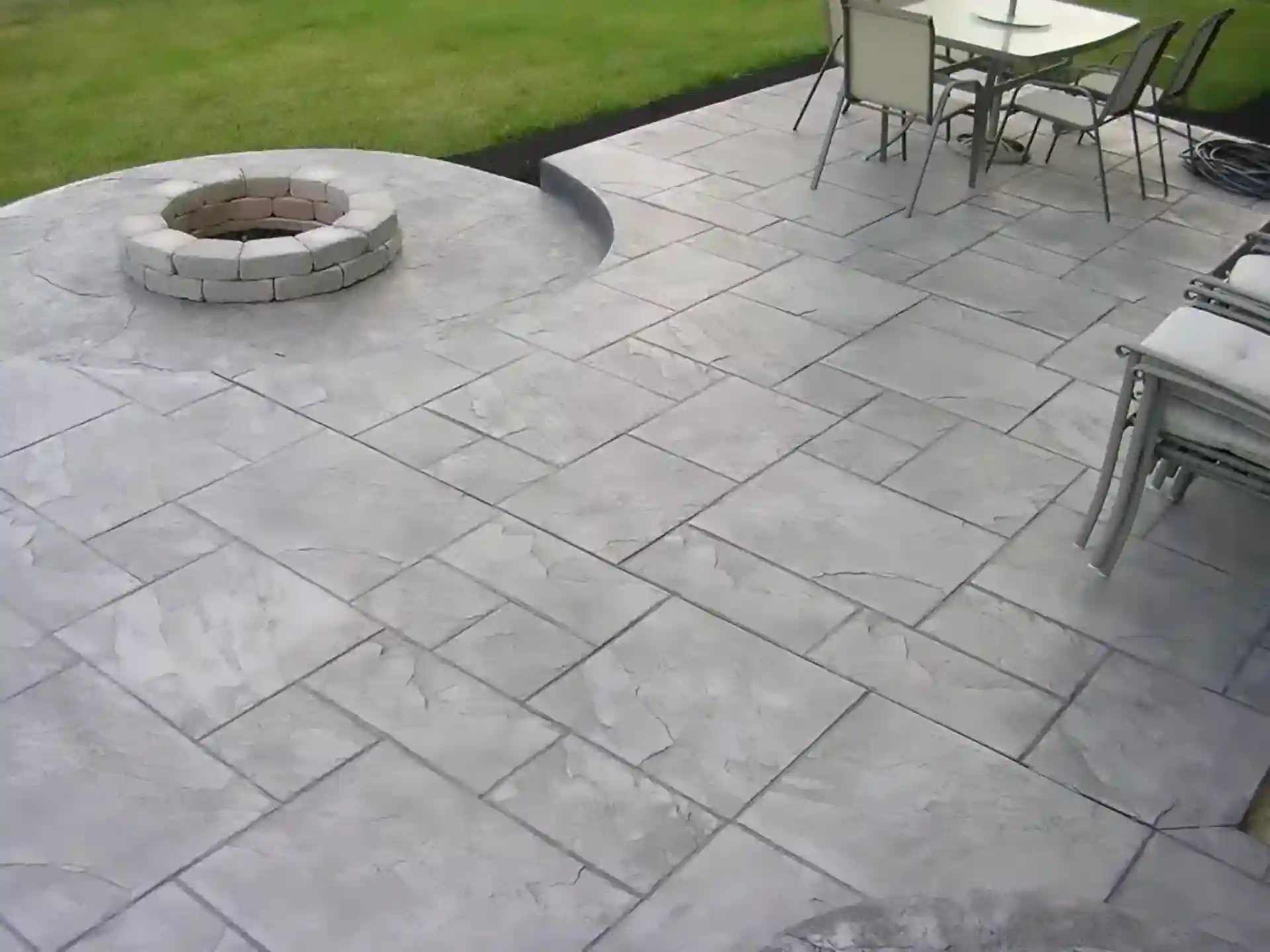 photo of a stamped concrete patio with fire pit